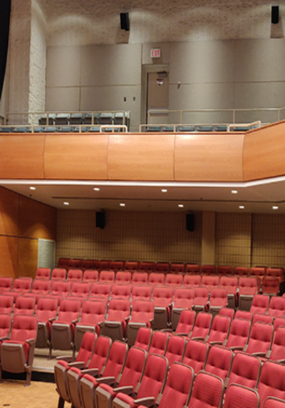 Red theatre seats in an auditorium